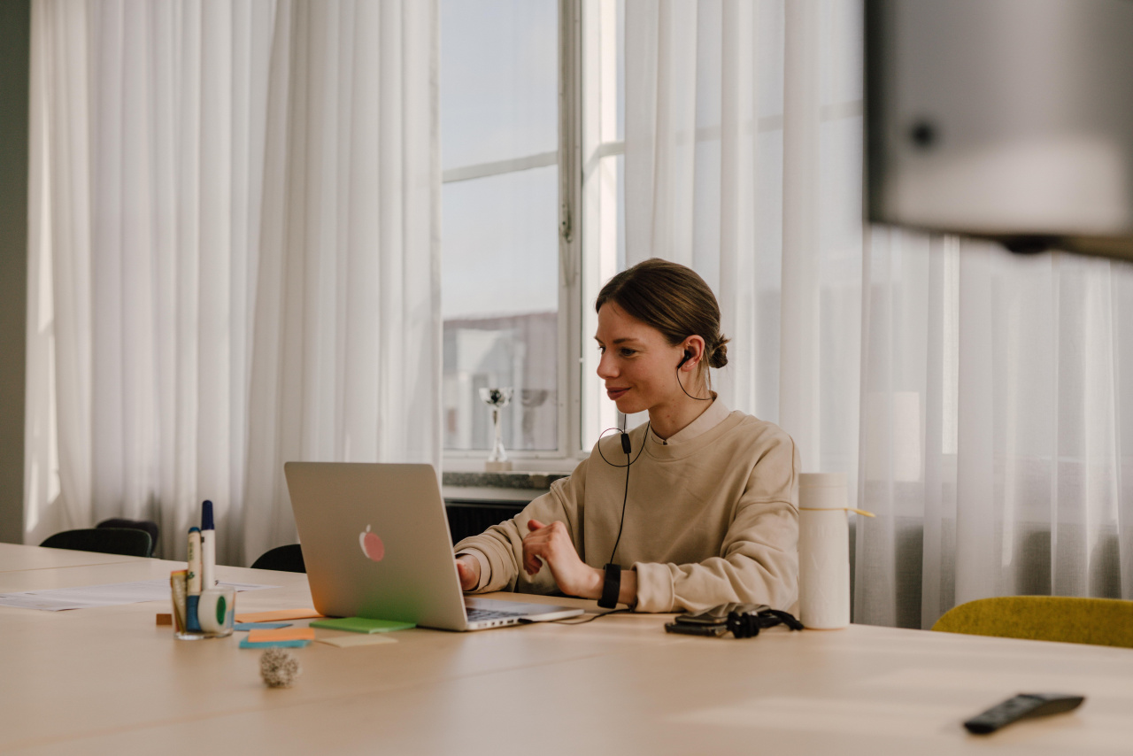 Verve Head of Operations Justine de Bruijn working on a laptop at a brightly lit office des