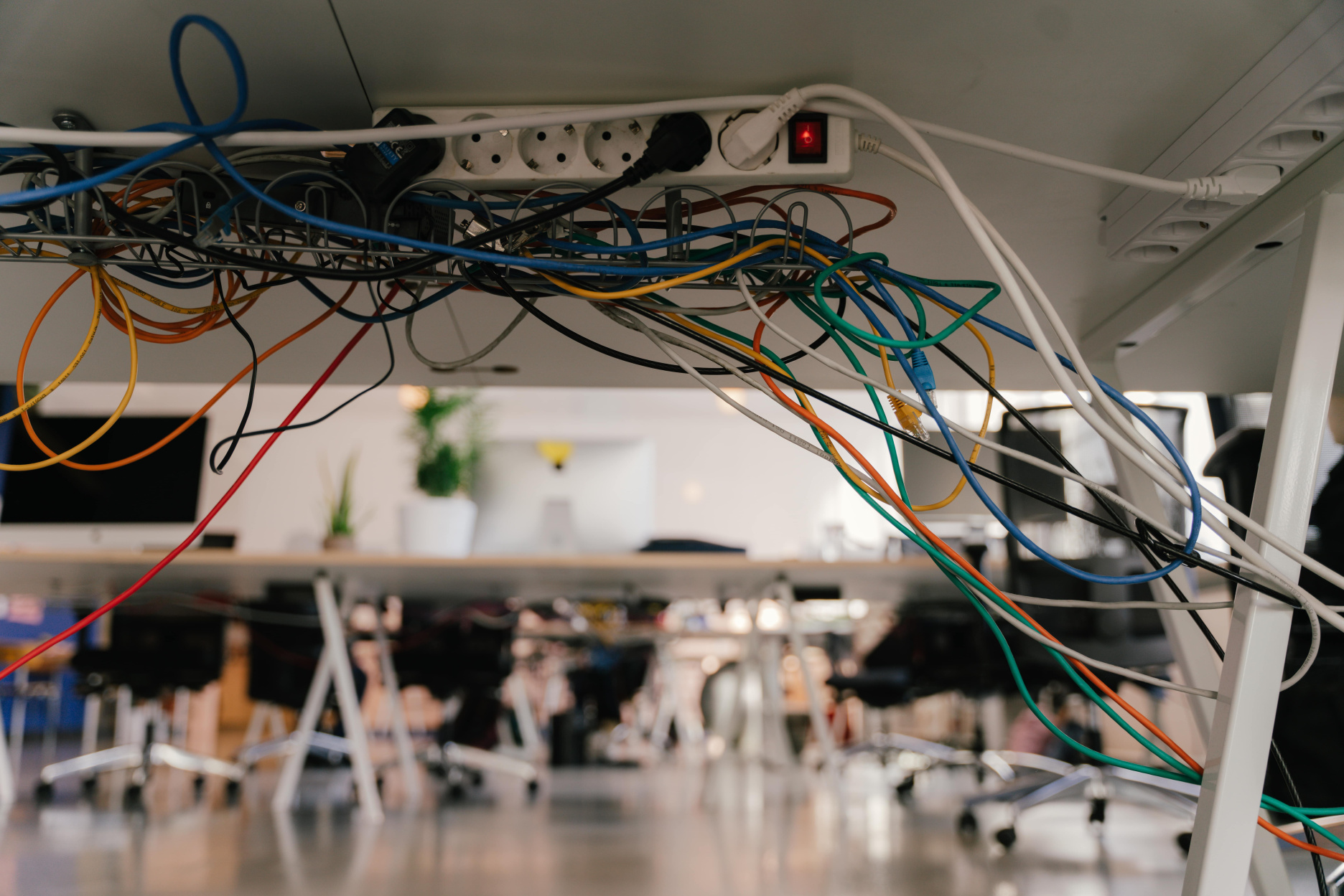 Connecting cables under office desk