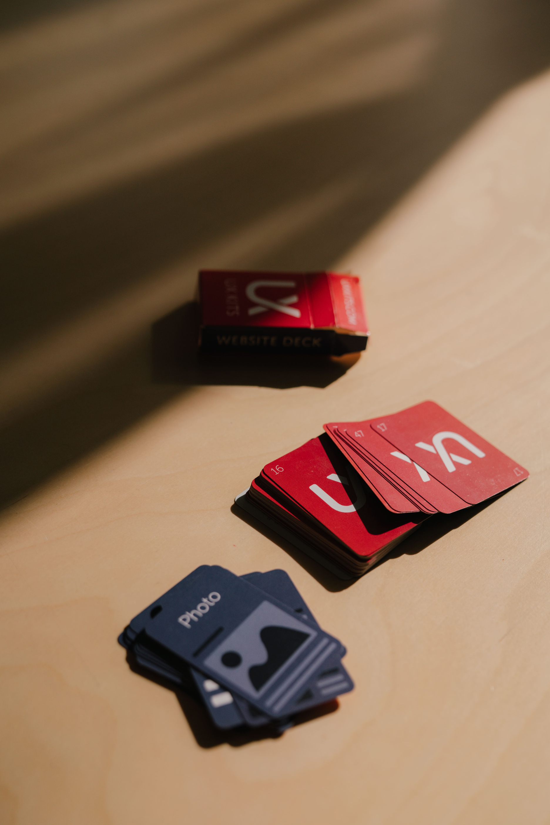 UX design deck of cards red and blue on a table