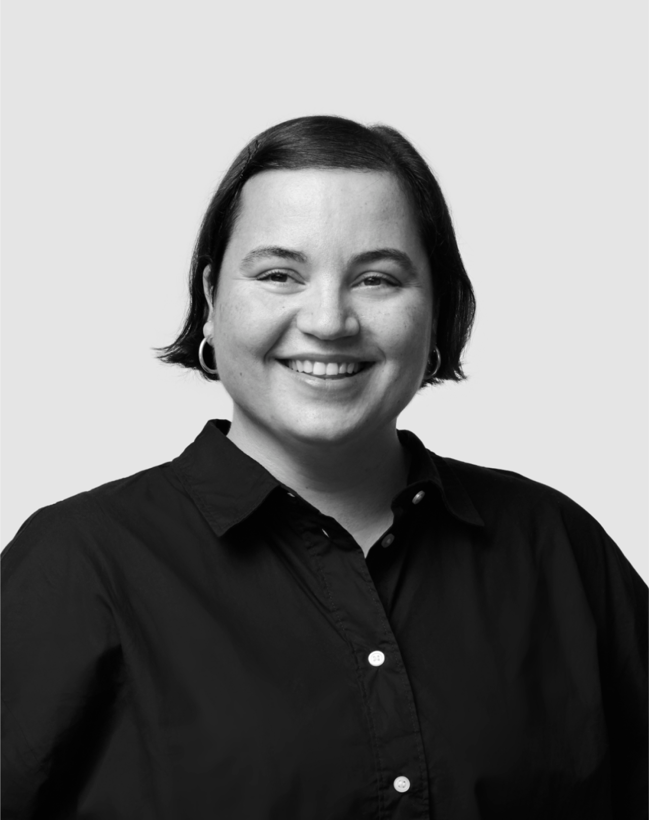 Black and white portrait of Nuria Cabrera, Brand Design Lead at Verve Agency, smiling