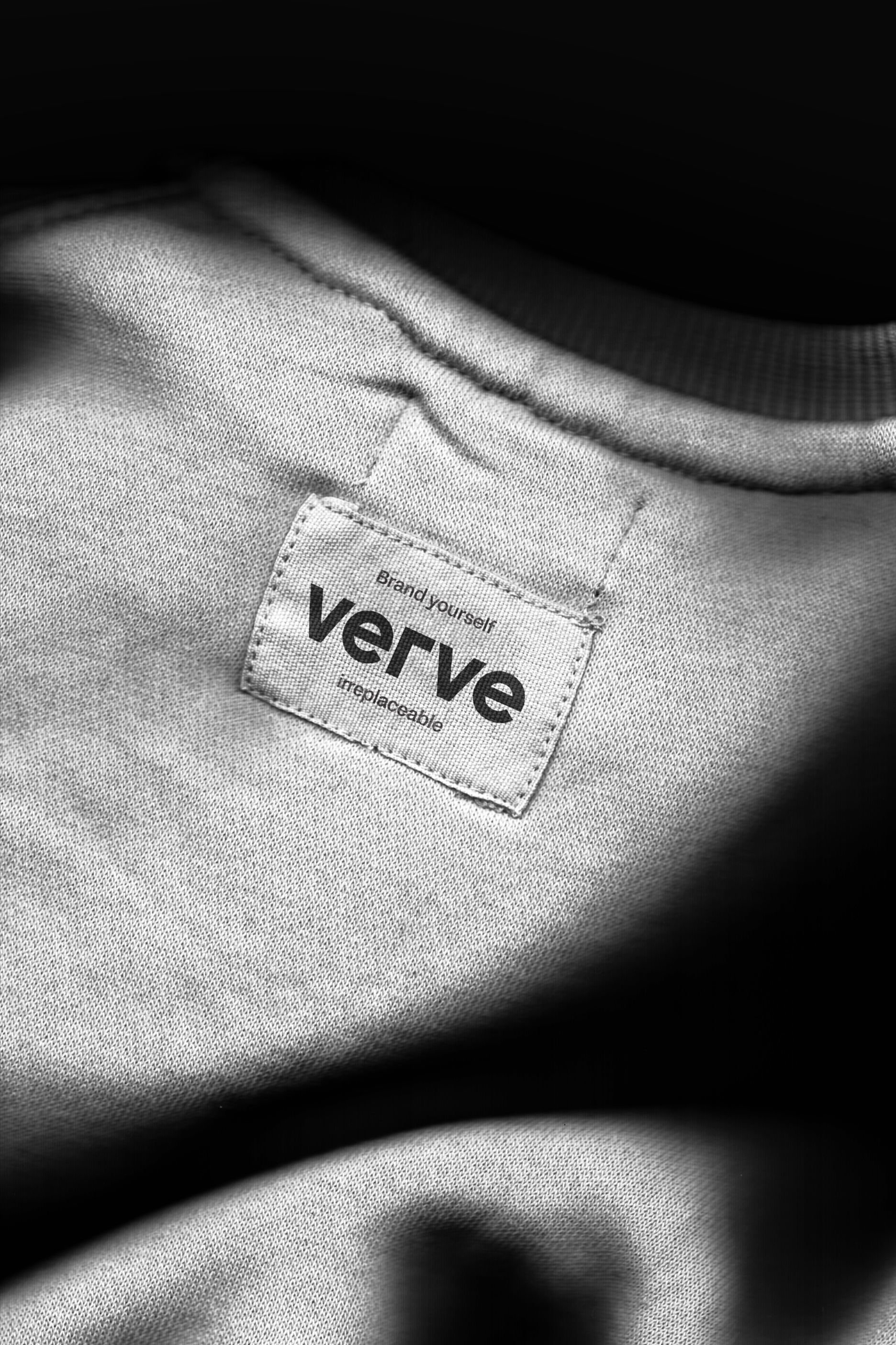 Macro photo of clothing tag reading Brand yourself Verve irreplaceable