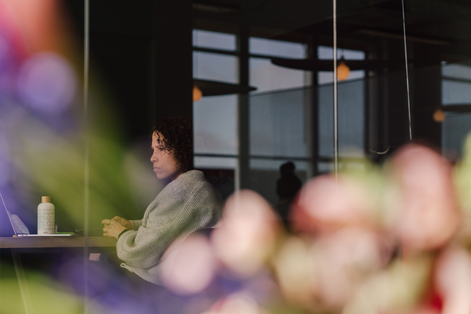 Out of focus picture of Yira working at Verve office